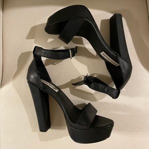 Black Steve Madden high, high platform heels. Size 8